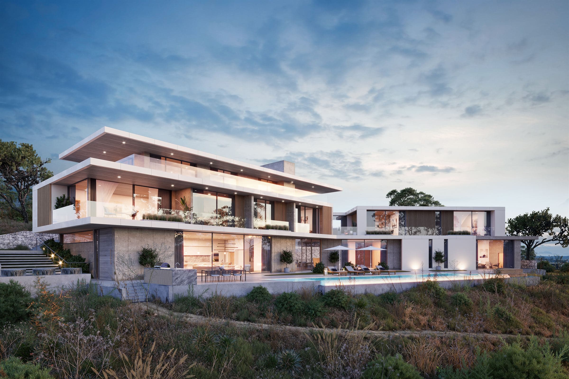 Contemporary two-storey villa with an infinity pool, lit up at dusk