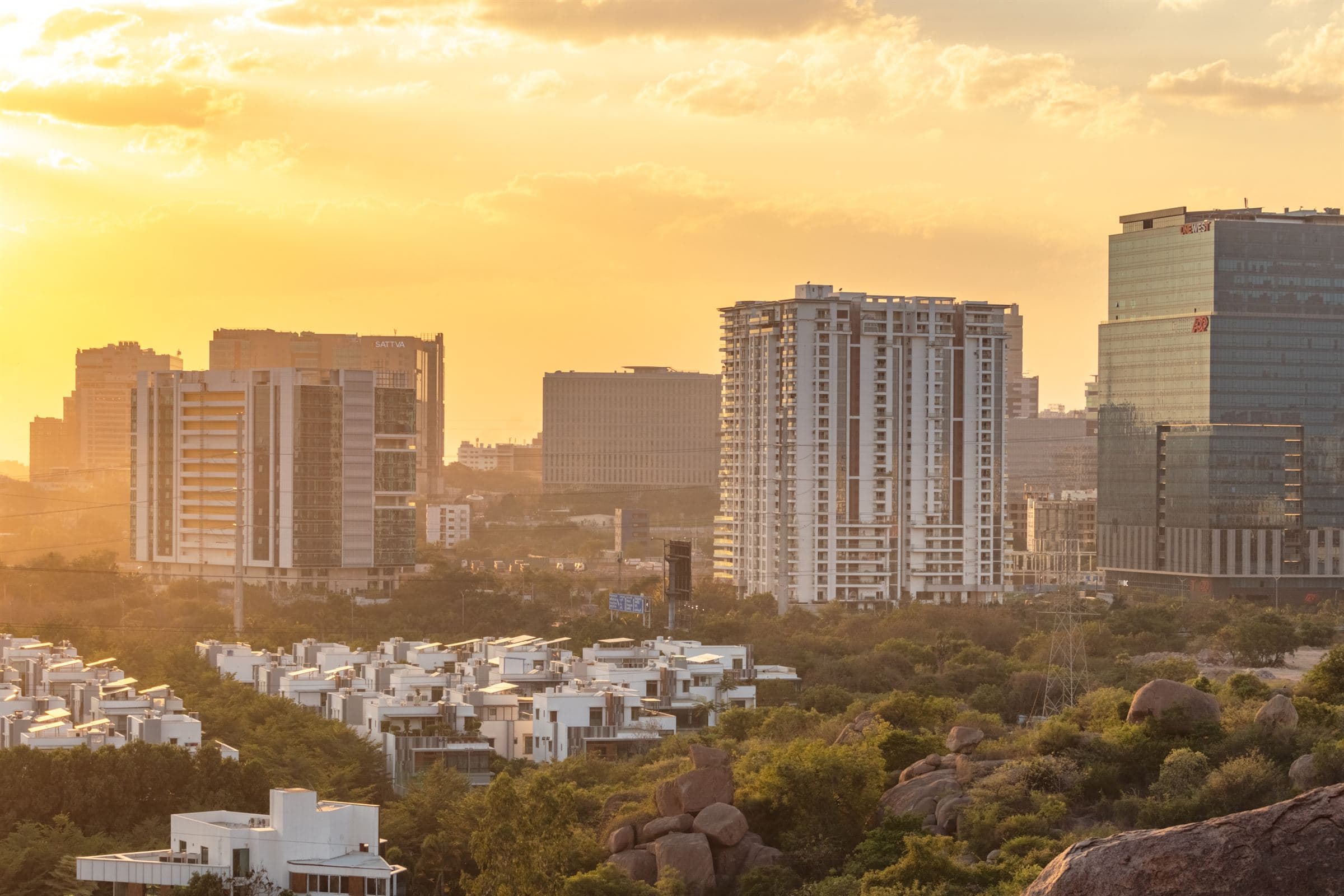 Villas and city towers glowing in the evening sun